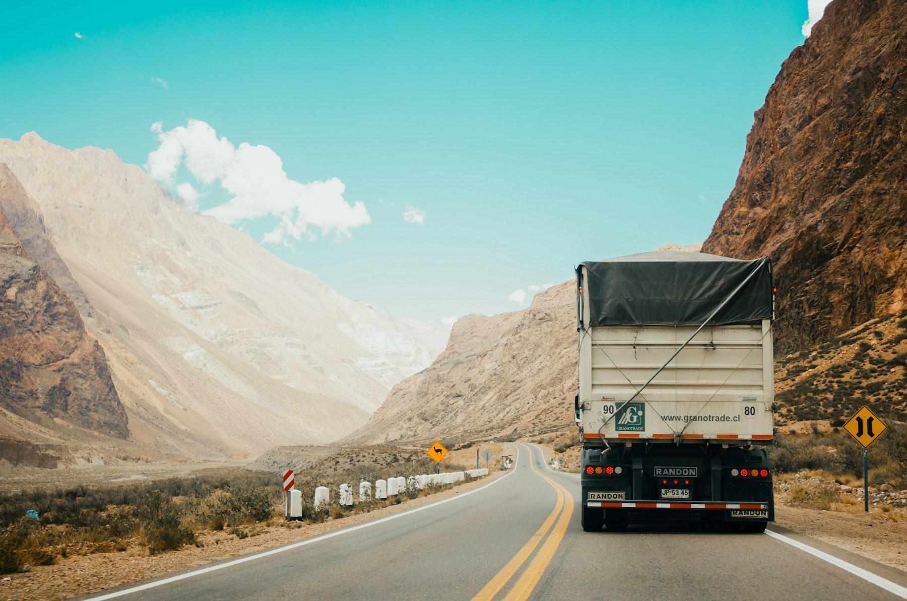 A commercial truck traveling on an open road