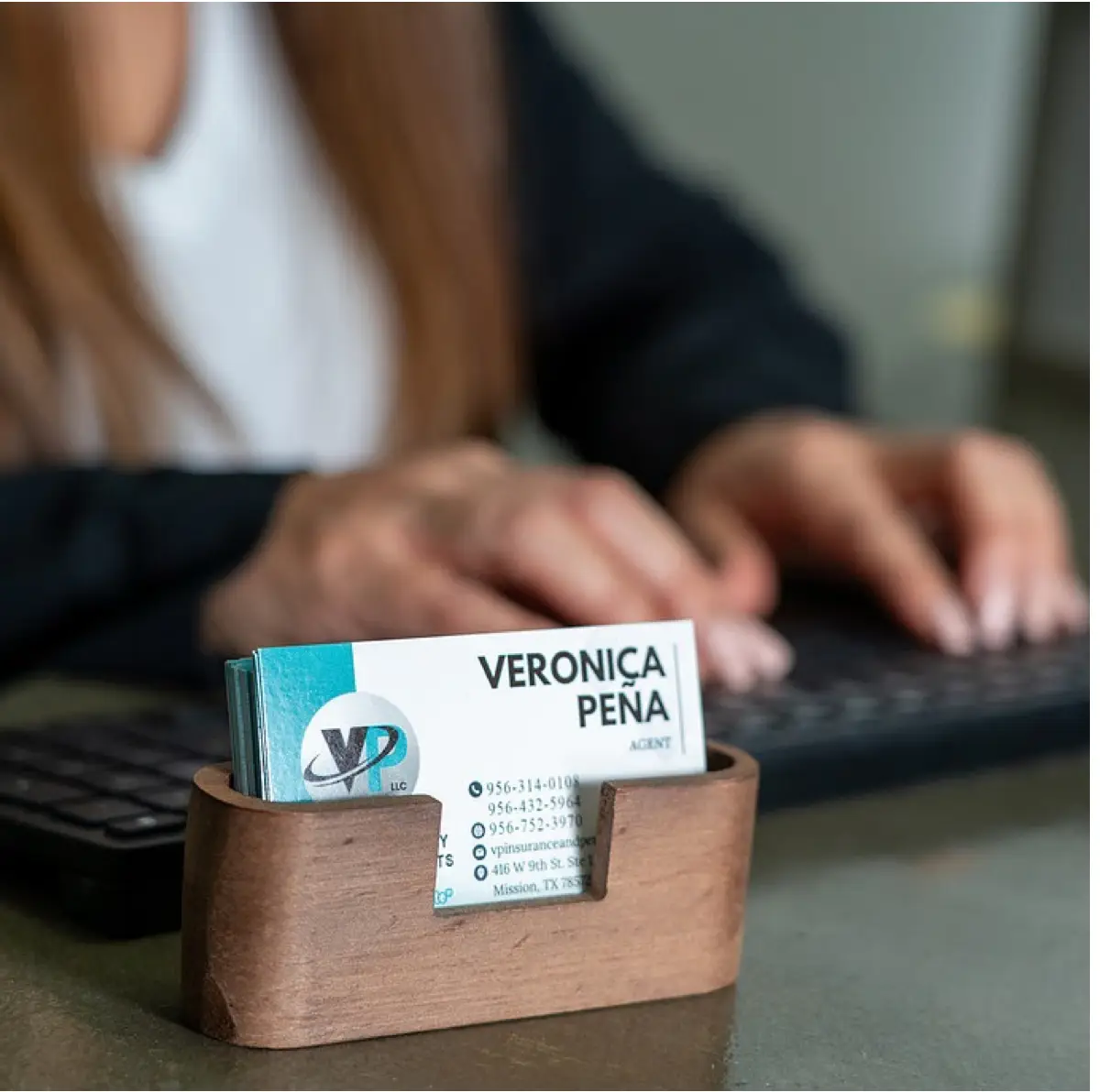 Veronica Peña’s VP Insurance business cards at the agency